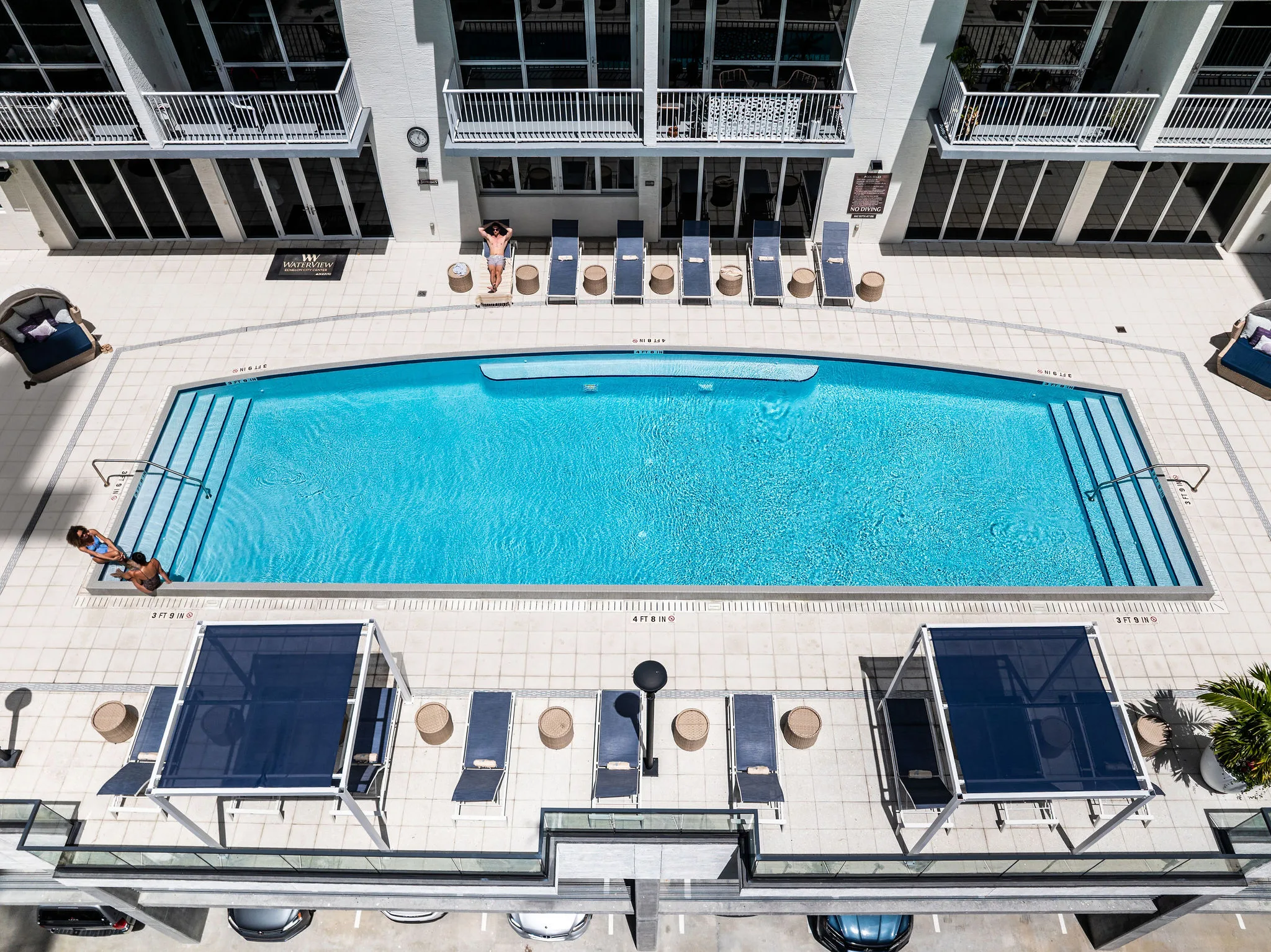 WaterView Echelon City Center's 7th-floor infinity pool deck with lounge chairs and cabanas, St. Petersburg, FL